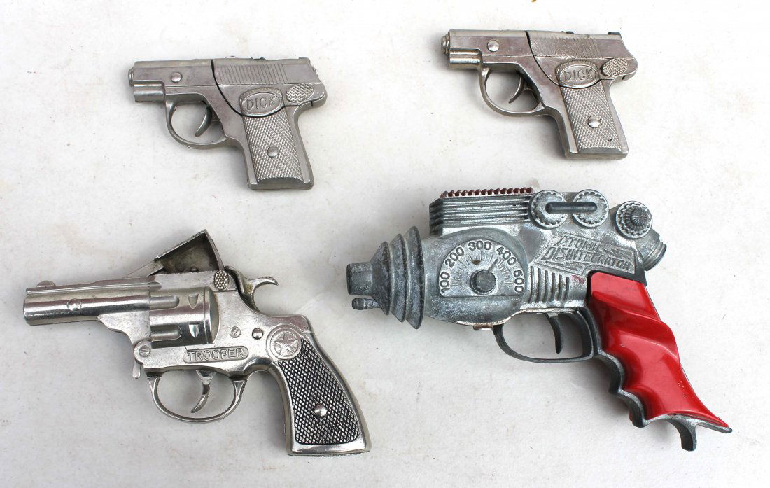 lot of 4 antique toy guns incl 3 cap guns & an "Ato: lot of 4 antique toy guns incl 3 cap guns & an "Atomic Disintegrator"