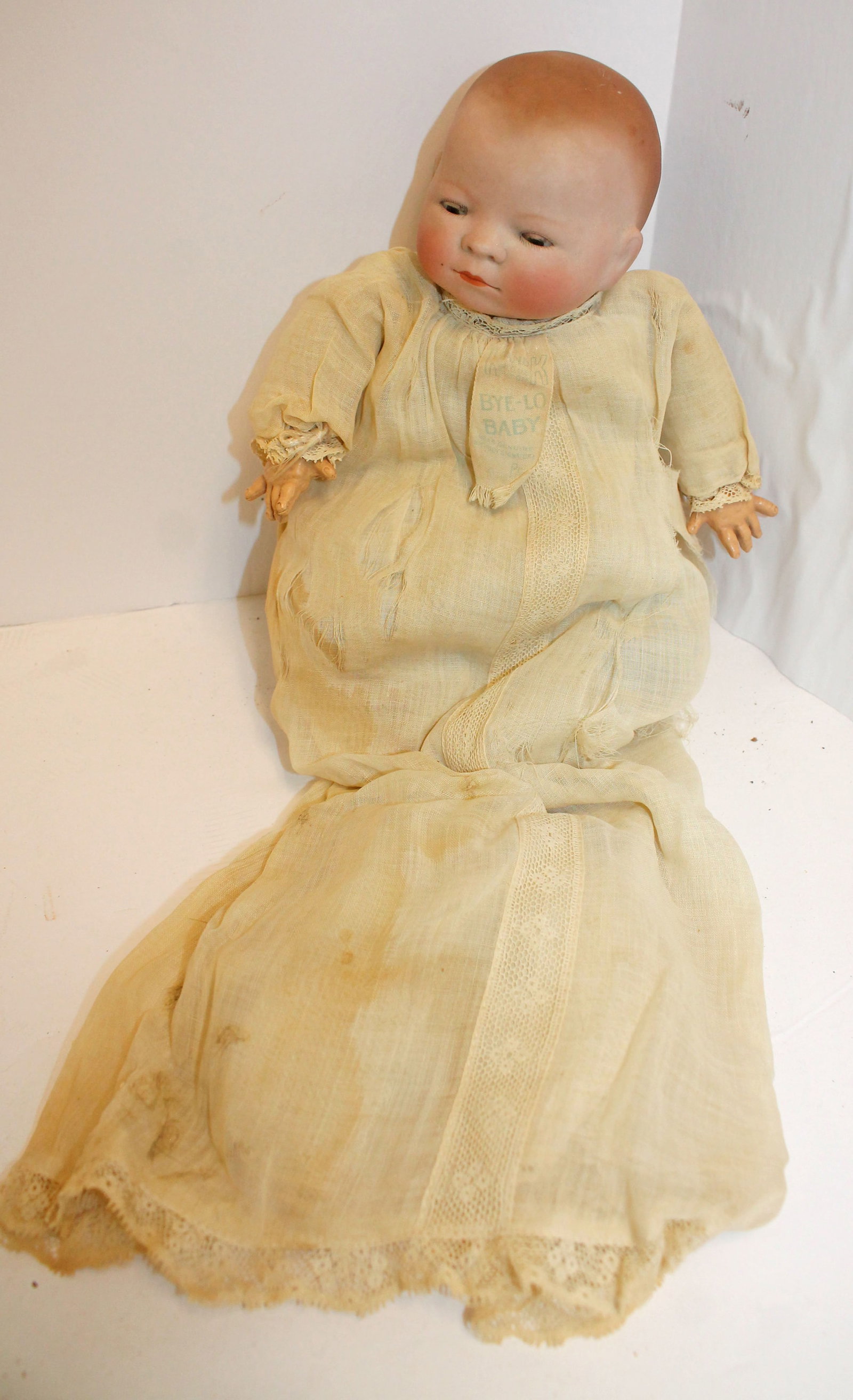 Antique Bye-Lo Baby in orig clothes w orig tag - 10 1/2" tall: Antique Bye-Lo Baby in orig clothes w orig tag - 10 1/2" tall