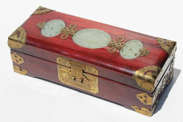 lot of 2 Chinese items - a 10" long brass bound je: lot of 2 Chinese items - a 10" long brass bound jewelry box w jade inserts & a 7" bats of happiness carved wooden plaque w 3" jade coin disc