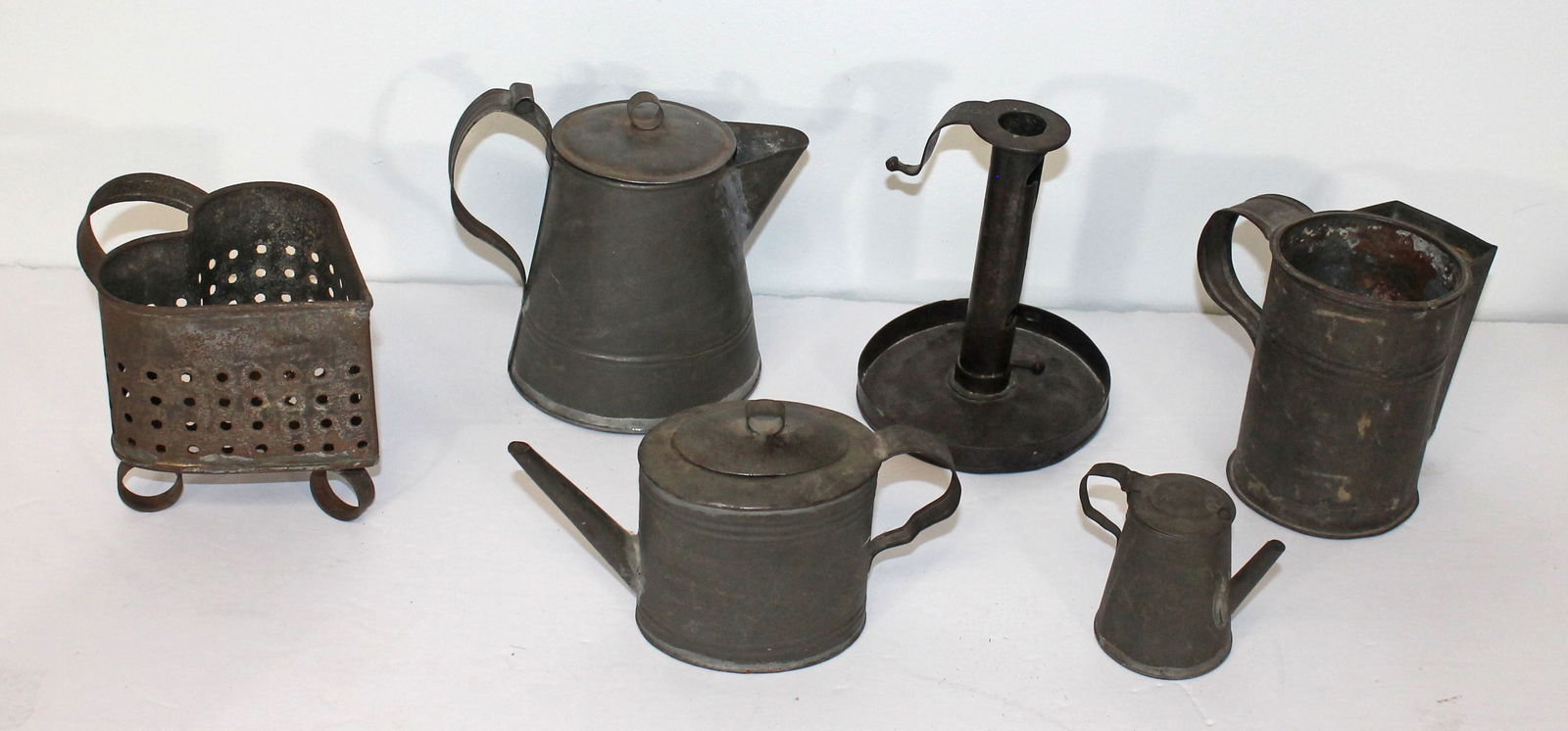 Lot of 7 antique tin items incl heart shaped cheese drain; teapots, candlestick & shaving cup w (1 of 10)