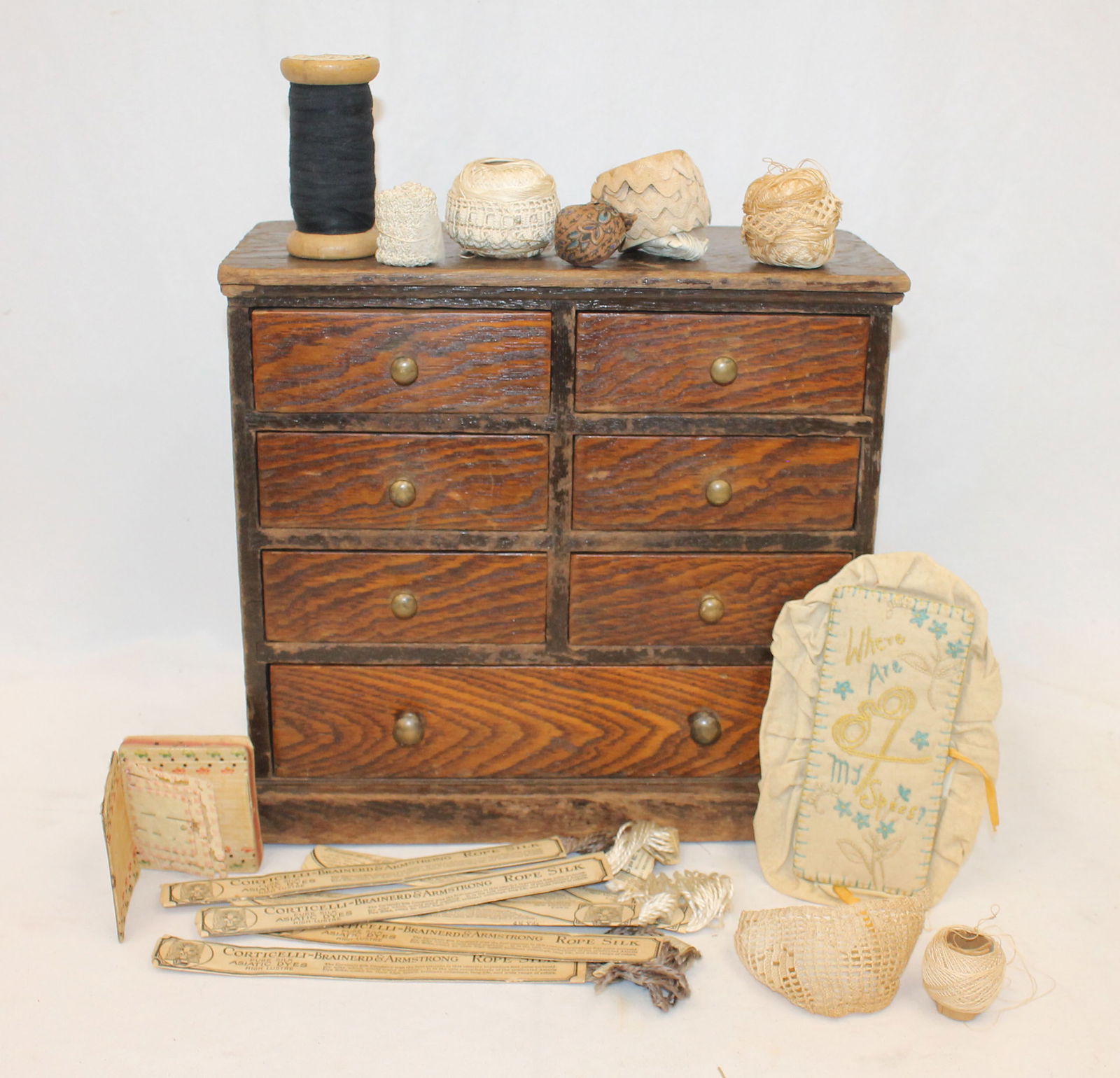 Antique set of drawers filled with sewing related items incl needle case, early spool, Mammy pin: Antique set of drawers filled with sewing related items incl needle case, early spool, Mammy pin emory; hand stitch glasses case, etc - 11" tall x 12" wide x 6" deep