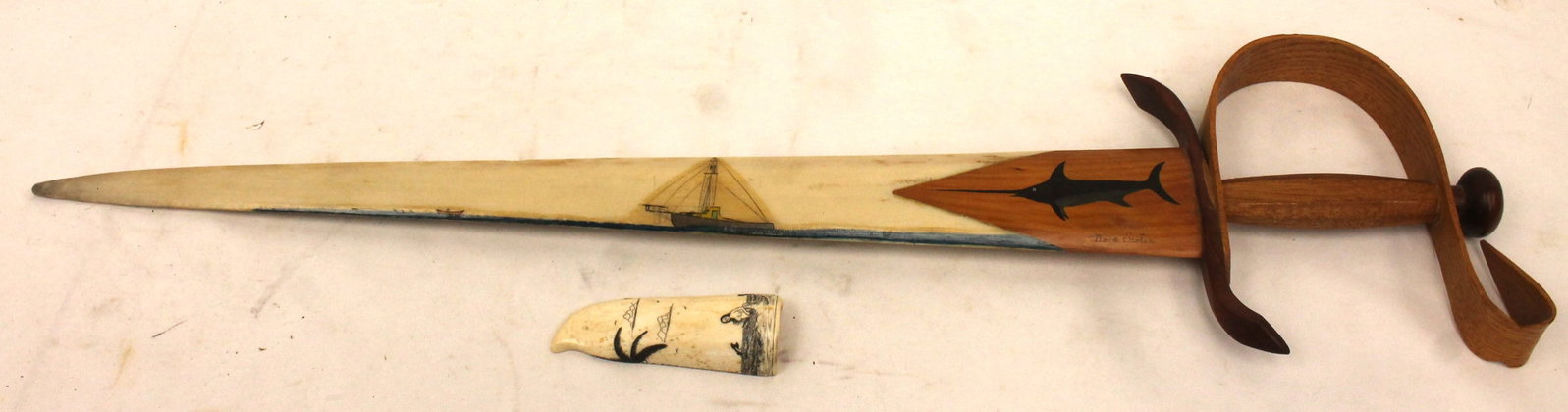 Artist sgnd bone 31" sword w wooden handle & scrimshawed ship & swordfish dec plus a fragment of a: Artist sgnd bone 31" sword w wooden handle & scrimshawed ship & swordfish dec plus a fragment of a scrimshawed bone 4 1/2" tooth