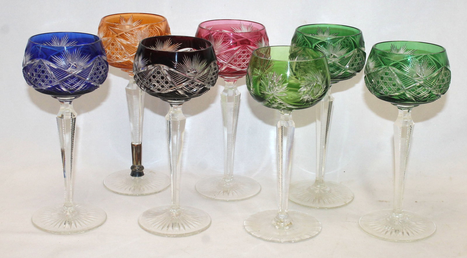 Set of 9 cut to clear crystal wine glasses in green, red, blue & orange - one with old make-do: Set of 9 cut to clear crystal wine glasses in green, red, blue & orange - one with old make-do repair to stem