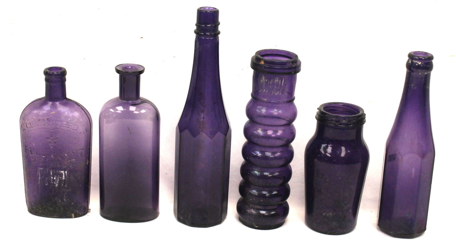 Large lot of 11 deep purple glass bottles & jars - 3 1/2" - 9 1/2" tall (1 of 12)