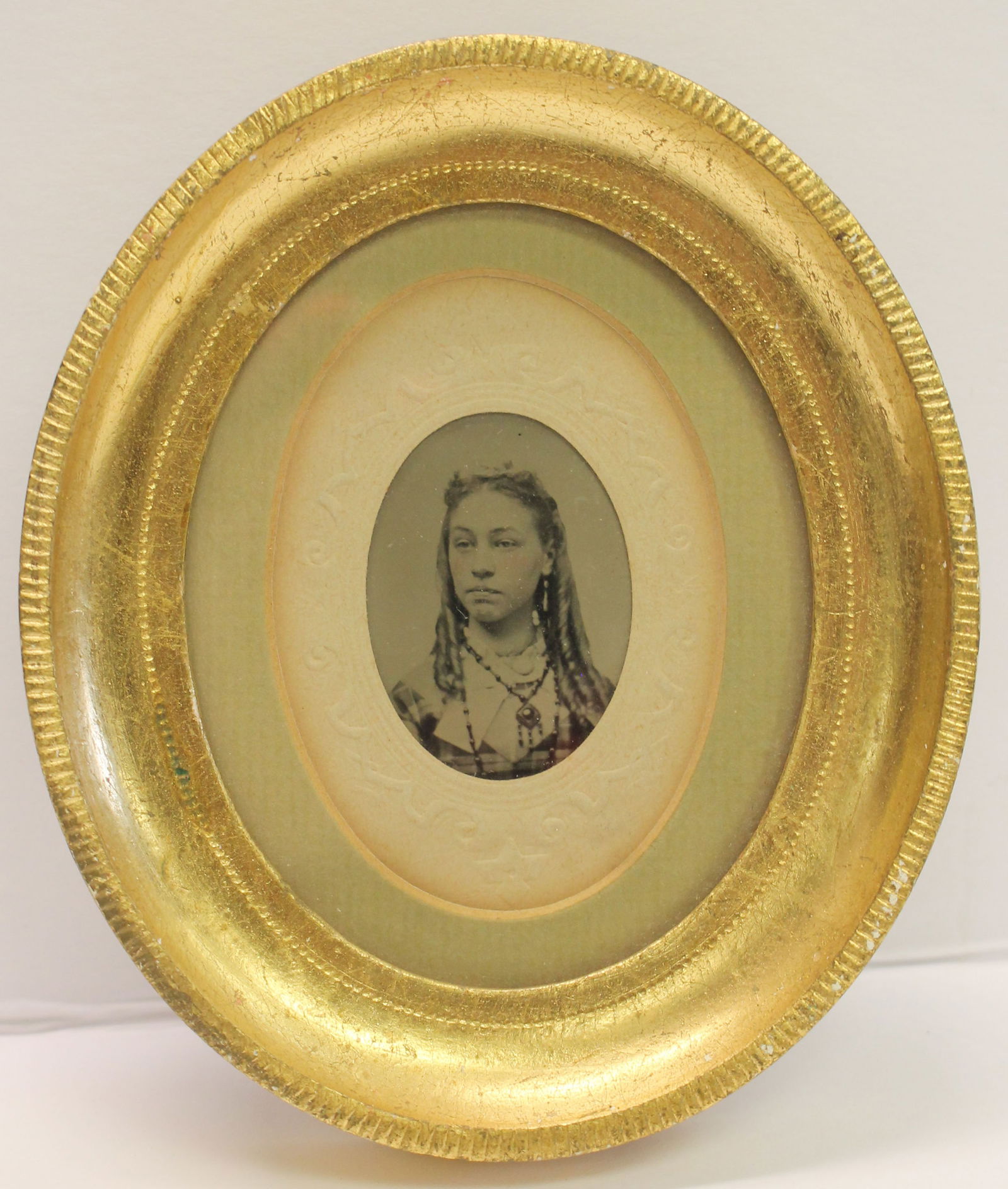 Oval framed highlighted photo of a girl - overall framed size 5 1/2"x4 1/2" (1 of 2)
