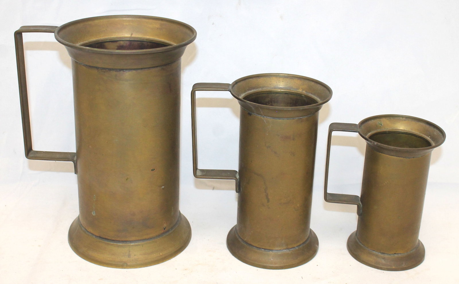 Set of 3 graduated trench art French brass measures/tankards - 9 1/2", 7 1/2" & 5 3/4" tall: Set of 3 graduated trench art French brass measures/tankards - 9 1/2", 7 1/2" & 5 3/4" tall