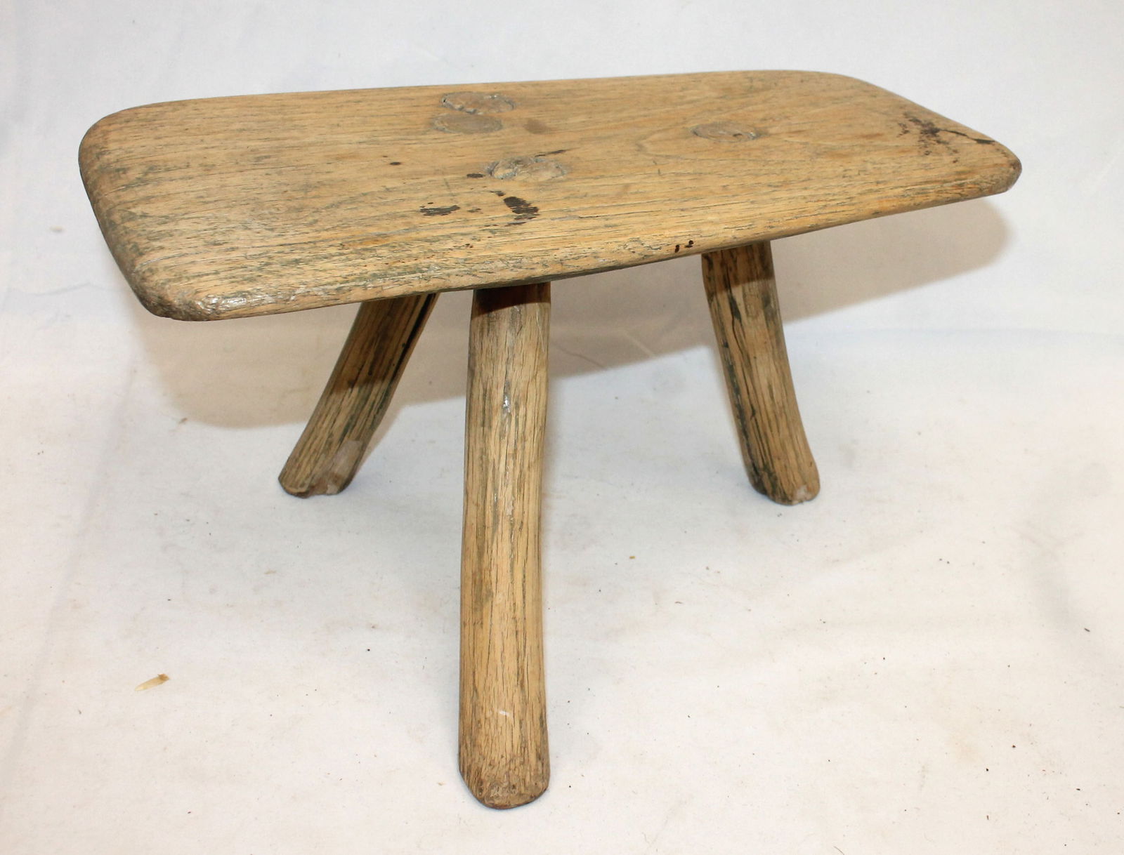 Antique milking stool in cream putty paint over green - 6" tall x 13 1/2" long x 6 1/2" deep (1 of 5)