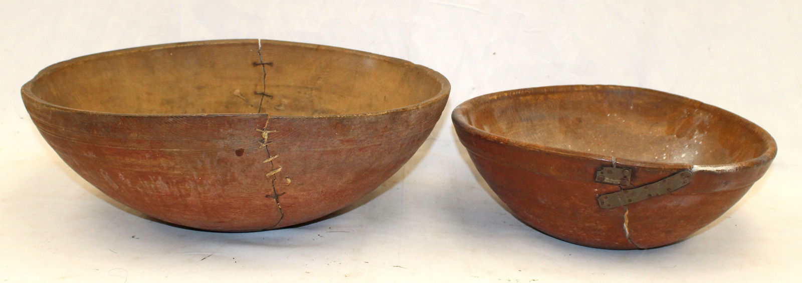 Lot of 2 large antique wooden bowls in red paint with old make do repairs - 15" & 19" diam (out of (1 of 11)