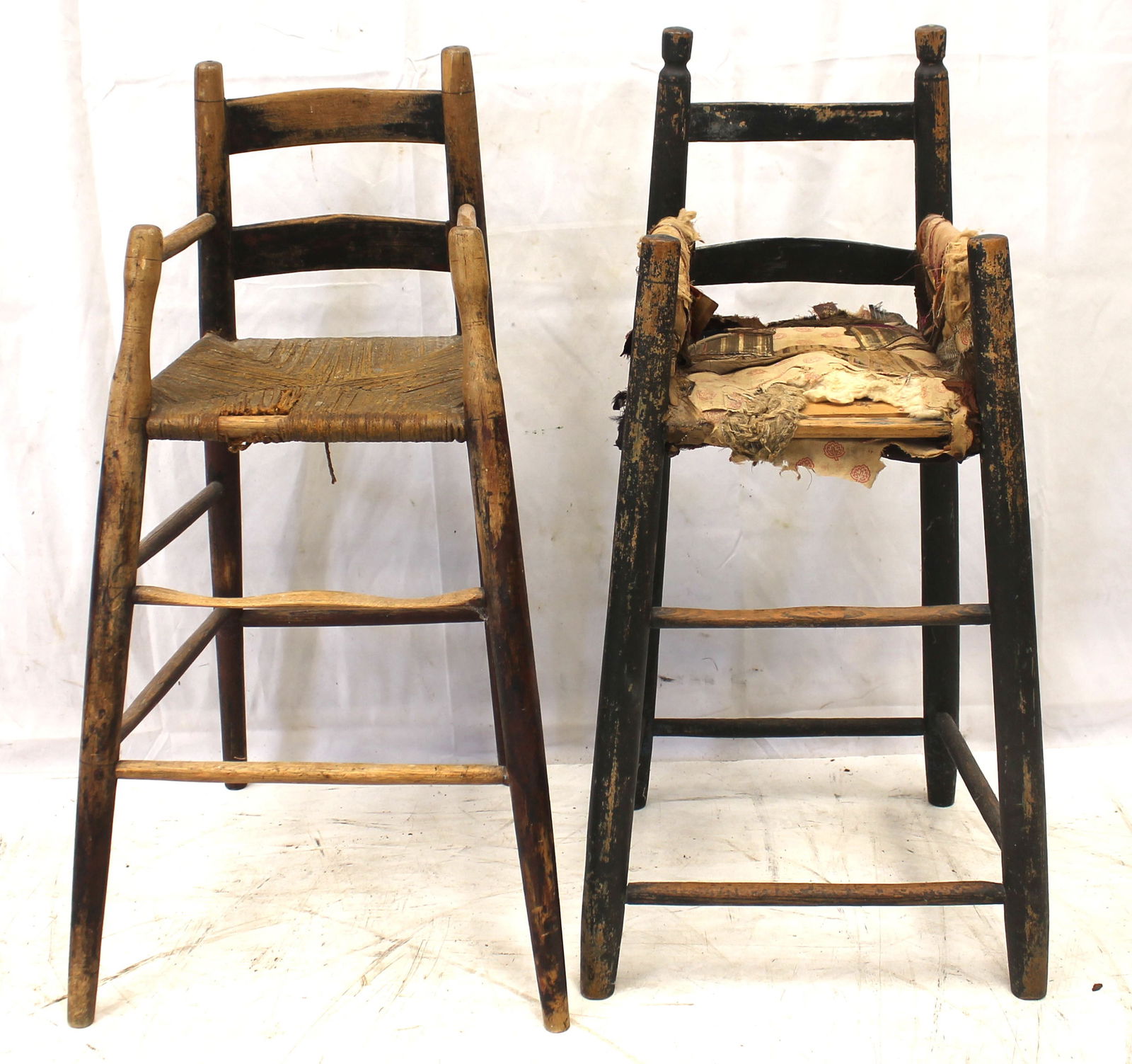 Lot of 2 youth high chairs - 1 in black w as found cloth seat & the other w traces of black paint, (1 of 5)