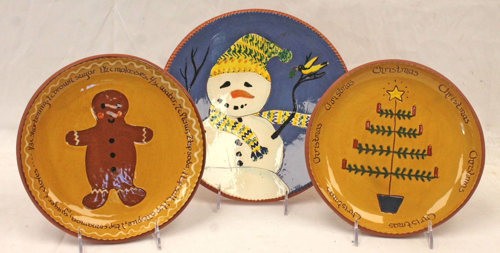 Lot of 3 contemporary redware plates w Gingerbread, Christmas tree & snowman decoration - 9" & 11": Lot of 3 contemporary redware plates w Gingerbread, Christmas tree & snowman decoration - 9" & 11" diam