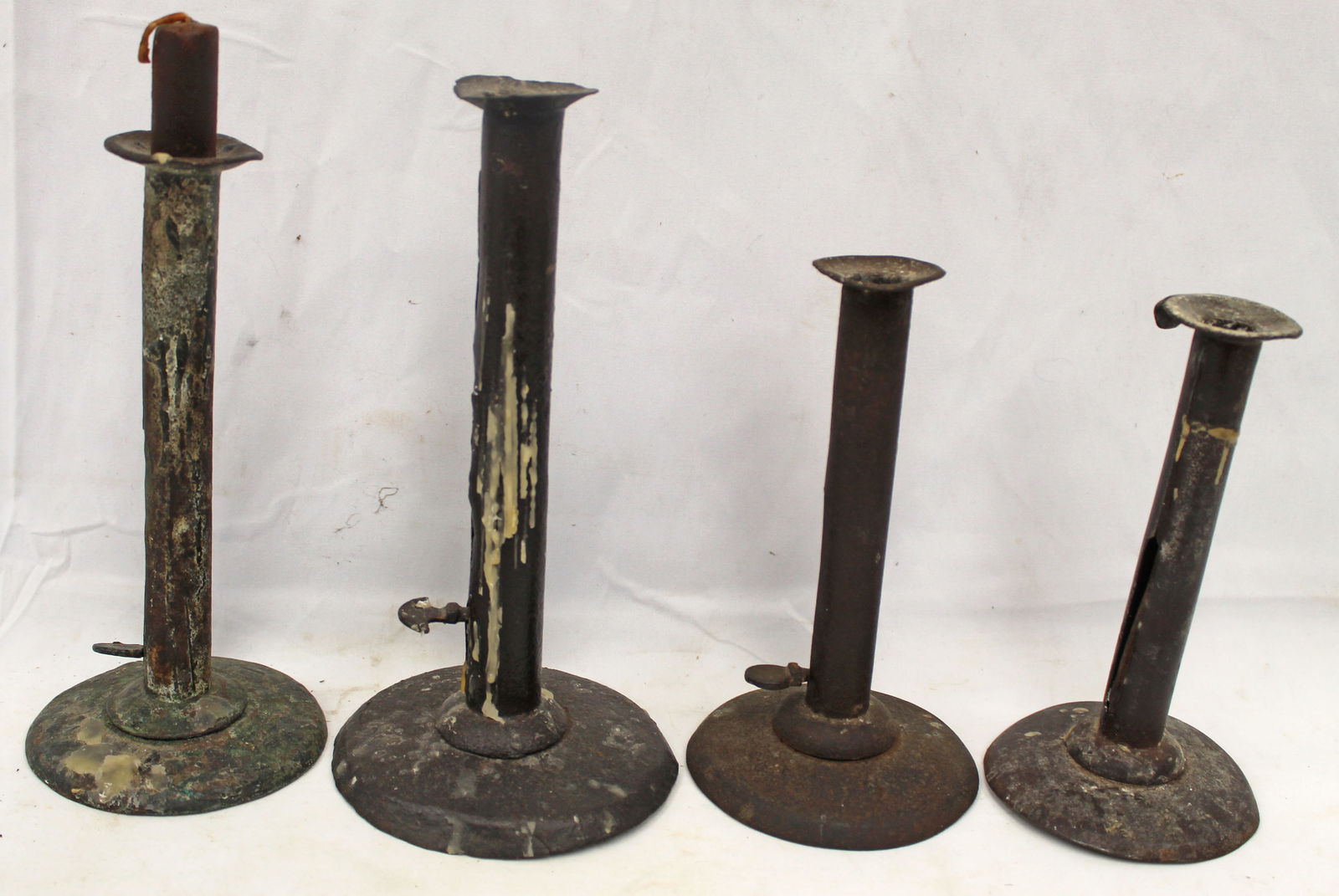 Lot of 4 antique tall tin push up candlesticks - 7", 7 1/2", 8 3/4" & 9 1/4" (1 of 7)