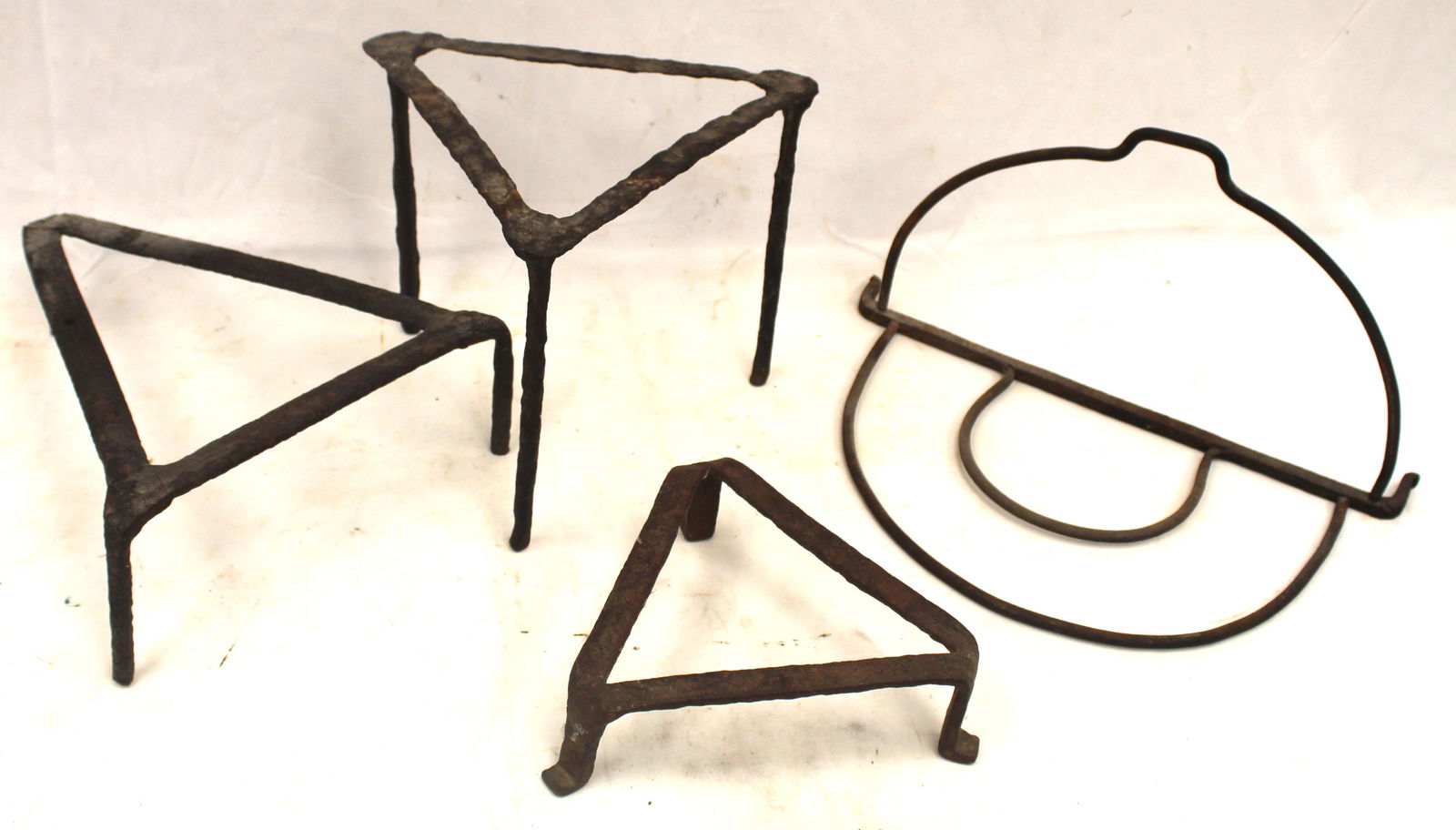 Lot of antique iron incl 3 triangular trivets & a pot stand (1 of 5)