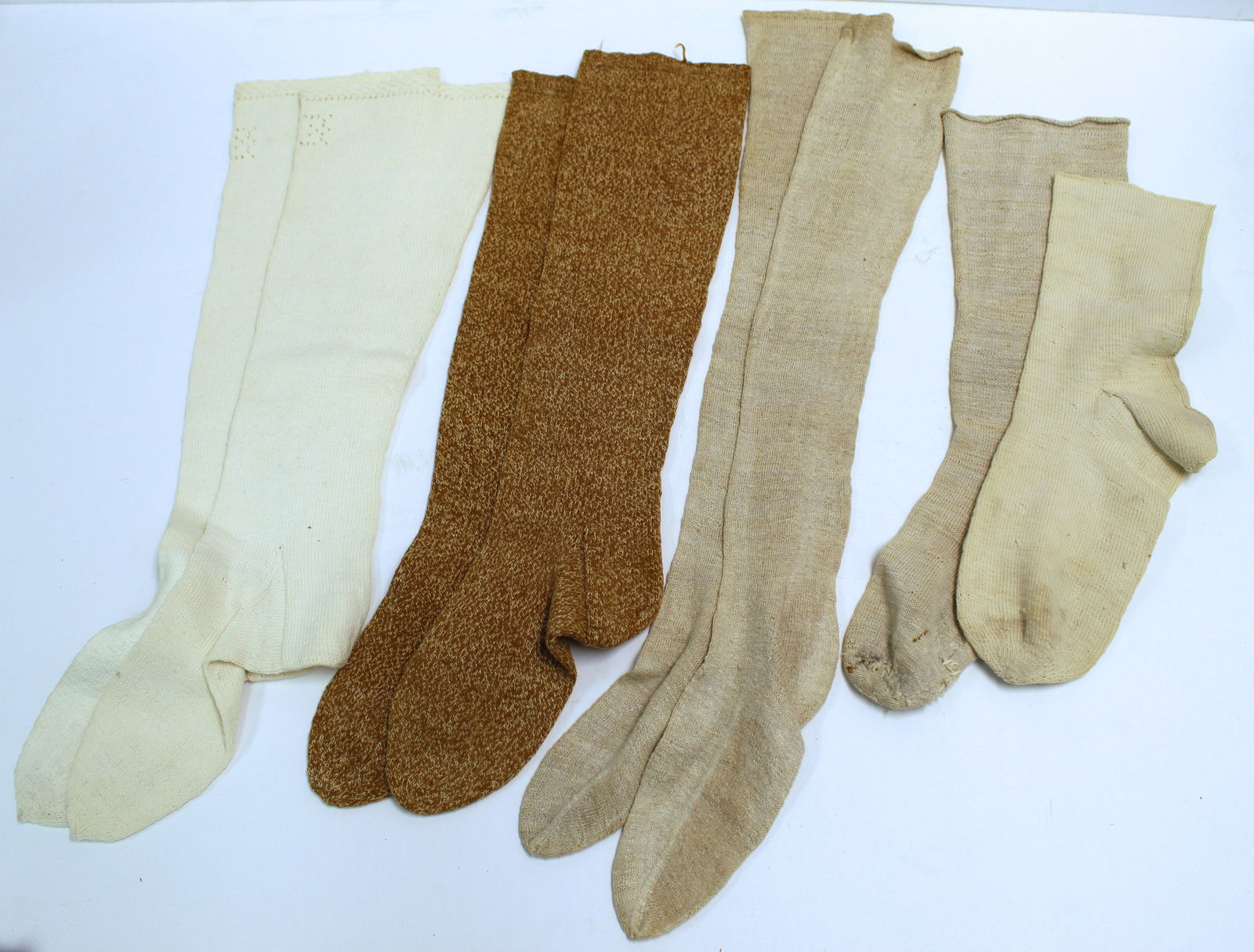 Lot of 4 prs of cream antique stockings incl a pr w initials EJC (1 of 10)