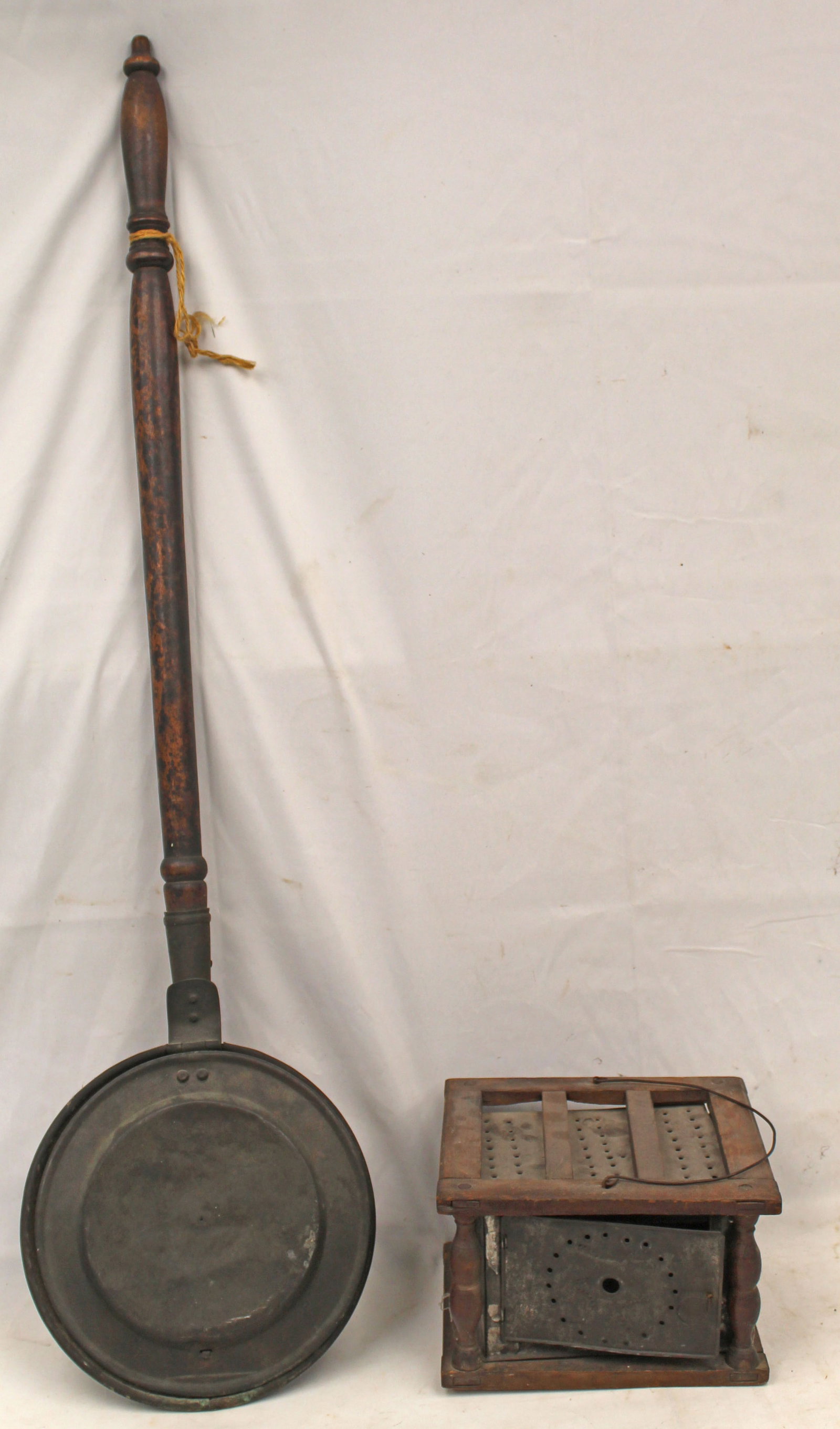 Antique wooden handled bedwarmer plus a wood & punched tin footwarmer - 41" long x 10" diam: Antique wooden handled bedwarmer plus a wood & punched tin footwarmer - 41" long x 10" diam bedwarmer