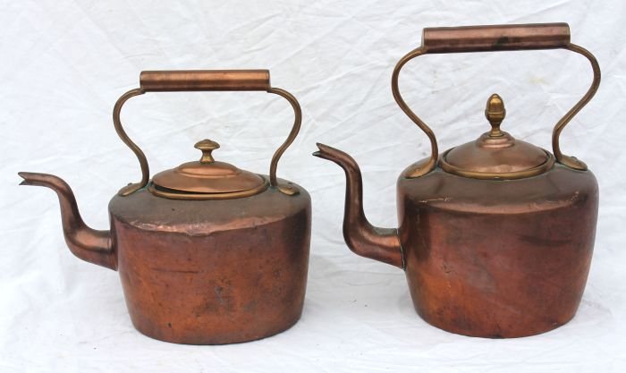 2 mid 19thC copper tea kettles w brass handles fea: 2 mid 19thC copper tea kettles w brass handles featuring dovetailed construction - 10" & 11 1/4" tall