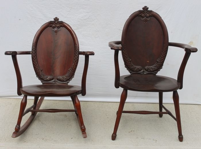 matching pr of antique dolphin carved armchairs in: matching pr of antique dolphin carved armchairs incl a ladies rocker & man's chair -32" & 37" tall