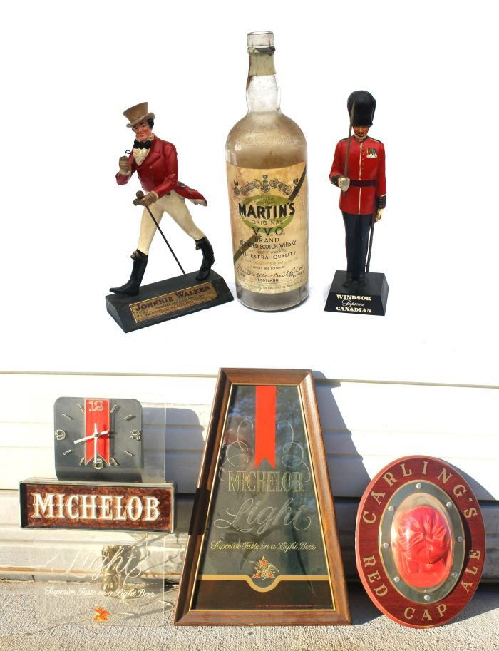 Lot of old liquor advertising incl Windsor 14 1/2": Lot of old liquor advertising incl Windsor 14 1/2" tall military figure; a 14" tall Johnny Walker whiskey dandy; an 18" Martin's VO whiskey bottle prop; Michelob clock; Michelob Lite mirror & a Carlin