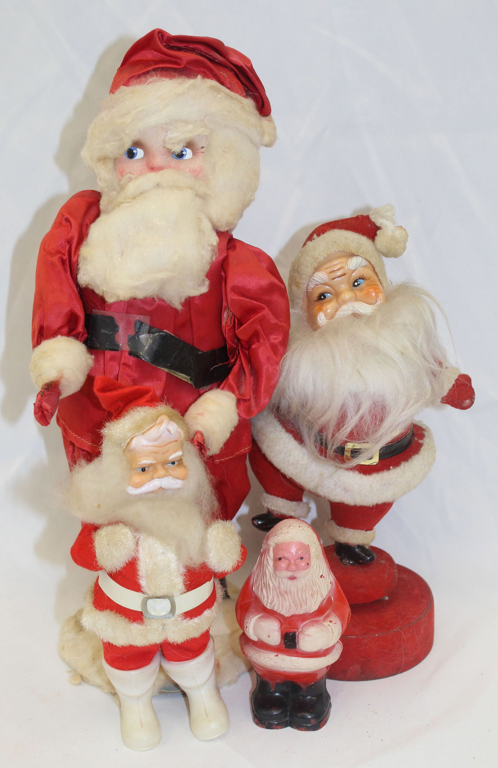Lot of 4 vintage Santa's incl celluloid, rubber faced, musical wind up (as found) & tallest has (1 of 4)
