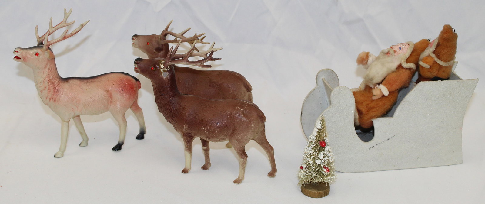 Vintage Santa's w tree riding in cardboard sleigh together w 3 celluloid reindeer (1 of 5)