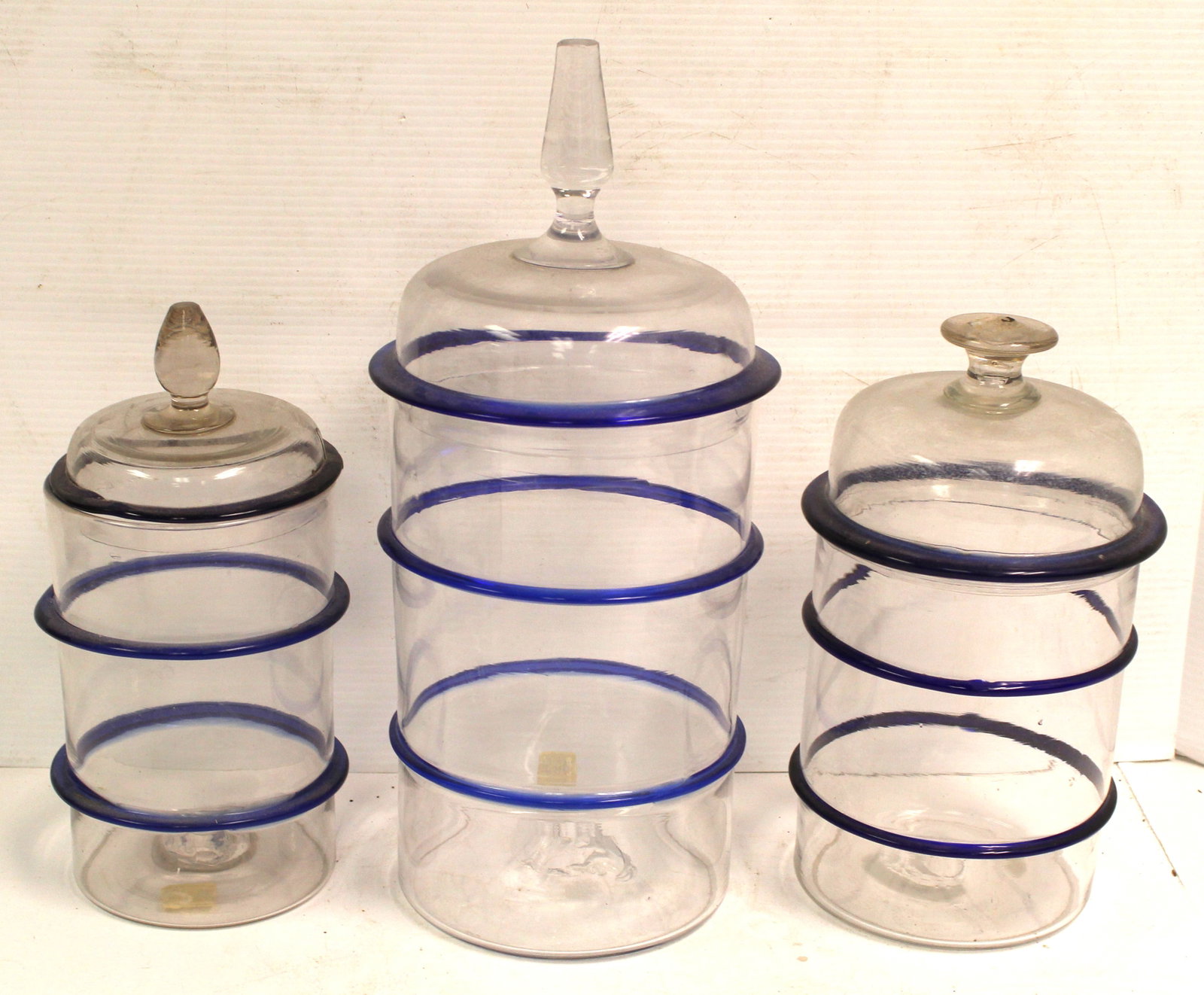 Lot of 3 graduated glass cannisters w cobalt blue stripes - 1 w cracked lid - 10 1/2", 11", 15 1/2": Lot of 3 graduated glass cannisters w cobalt blue stripes - 1 w cracked lid - 10 1/2", 11", 15 1/2" tall
