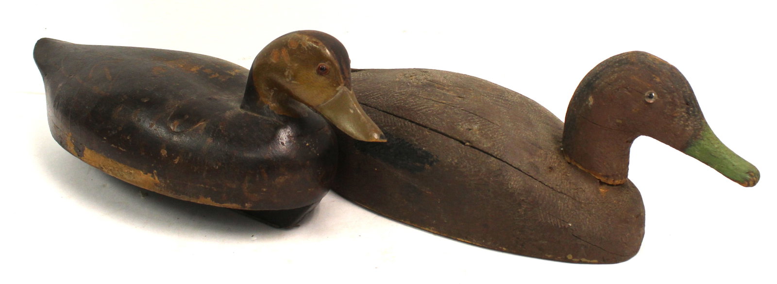 Lot of 2 carved wooden & painted duck decoys - 7"x18" & 6 1/2"x16": Lot of 2 carved wooden & painted duck decoys - 7"x18" & 6 1/2"x16"