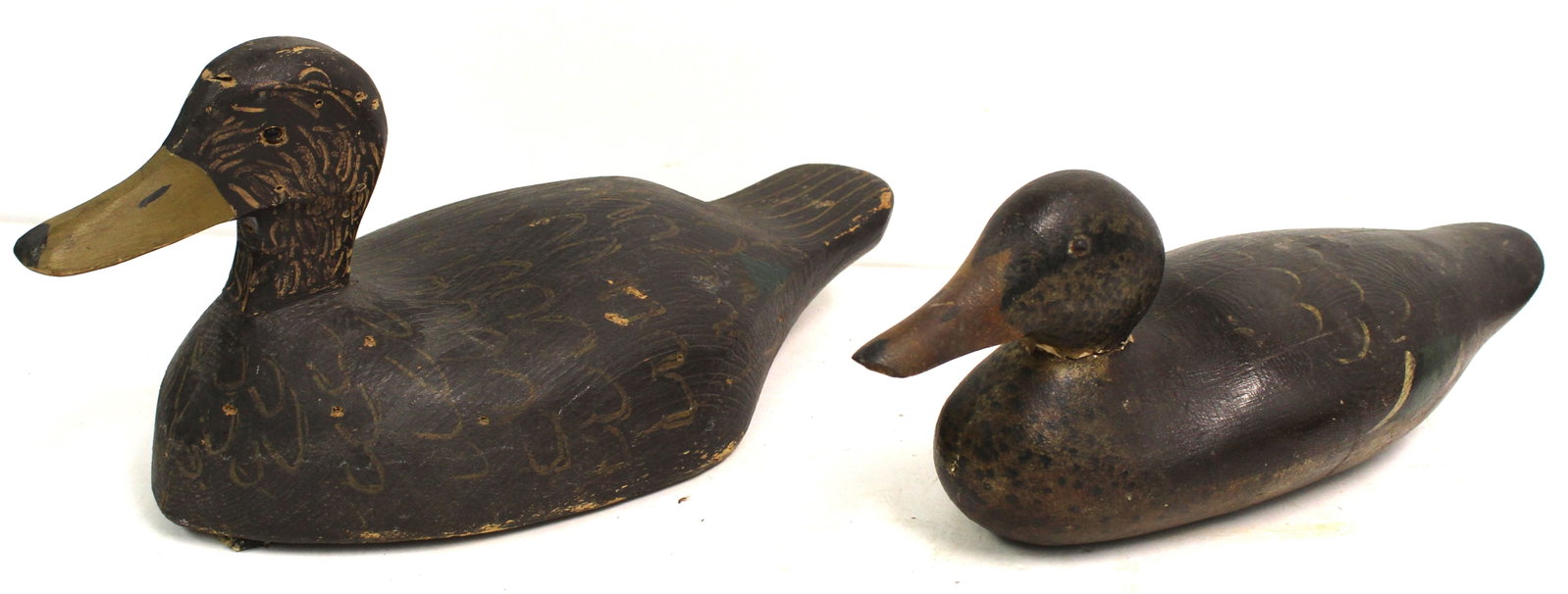 Lot of 2 carved wooden & painted duck decoys - 8"x17" & 6"x16": Lot of 2 carved wooden & painted duck decoys - 8"x17" & 6"x16"