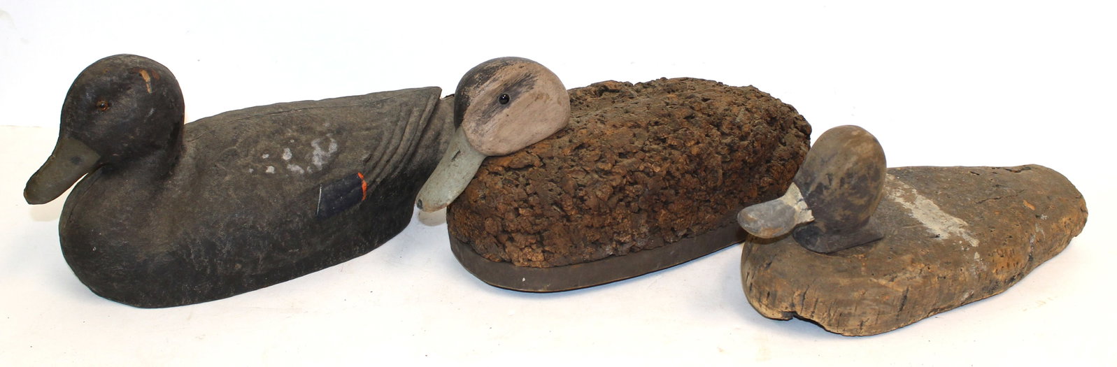 Lot of 2 cork duck decoys w wooden heads plus a molded composite duck decoy - 6"x13 1/2", 5 1/2"x13": Lot of 2 cork duck decoys w wooden heads plus a molded composite duck decoy - 6"x13 1/2", 5 1/2"x13" & 6 1/2"x14"