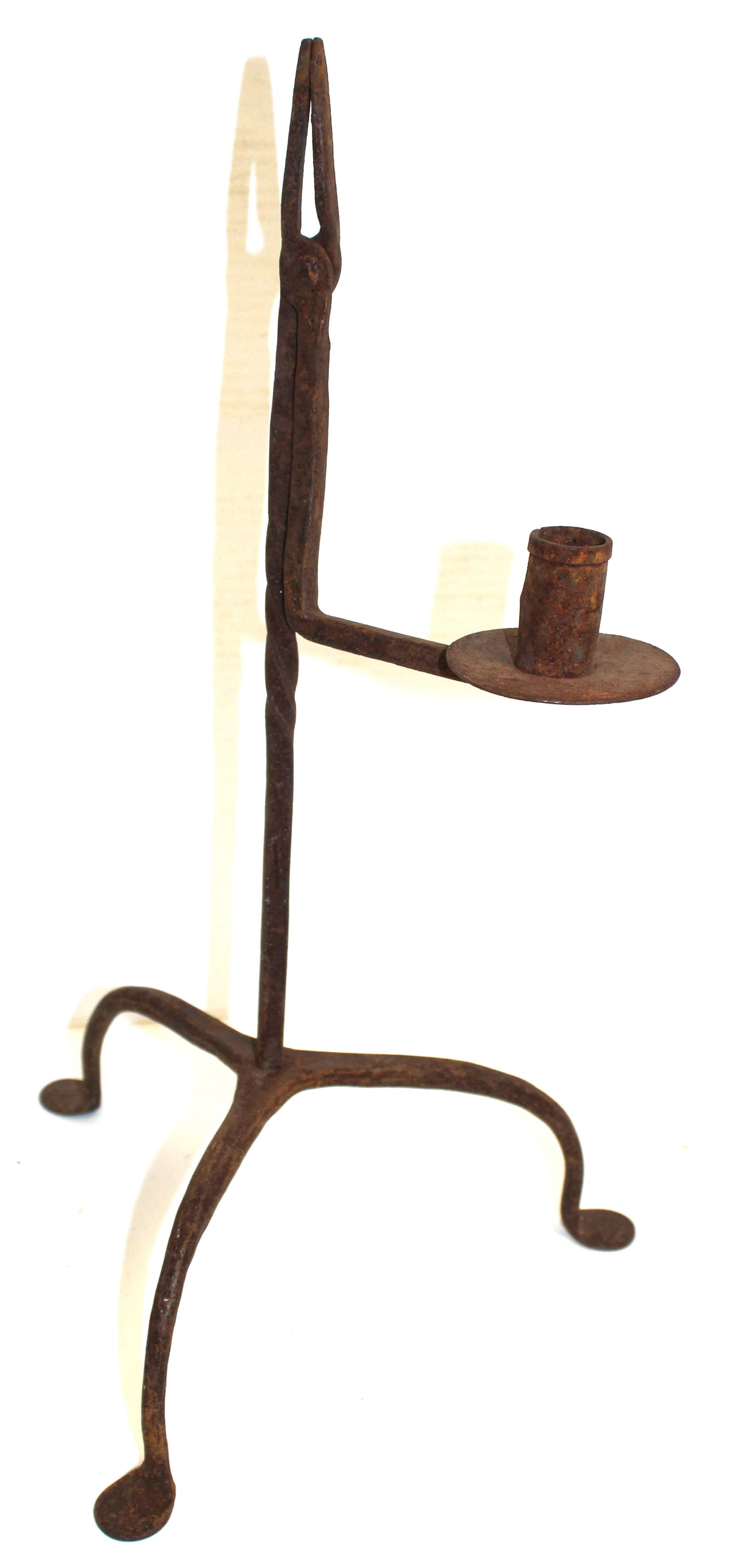Wrought iron candle holder rush light on tripod foot: Wrought iron candle holder rush light on tripod foot