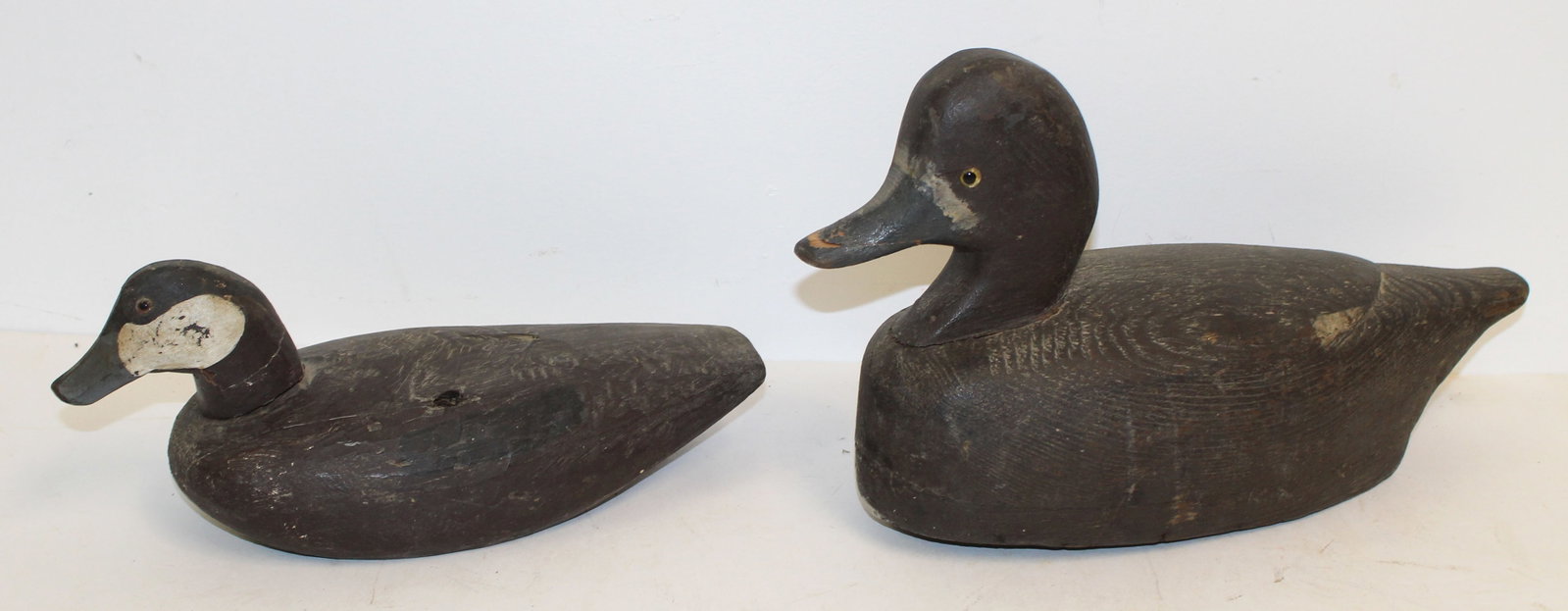 Lot of 2 carved wooden duck decoys - 7"x15" & 4 1/2"x11 1/2": Lot of 2 carved wooden duck decoys - 7"x15" & 4 1/2"x11 1/2"