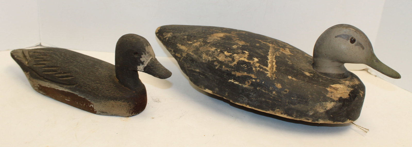 Lot of 2 carved wooden duck decoys - large one has plastic head - 6"x15" & 5"x11": Lot of 2 carved wooden duck decoys - large one has plastic head - 6"x15" & 5"x11"