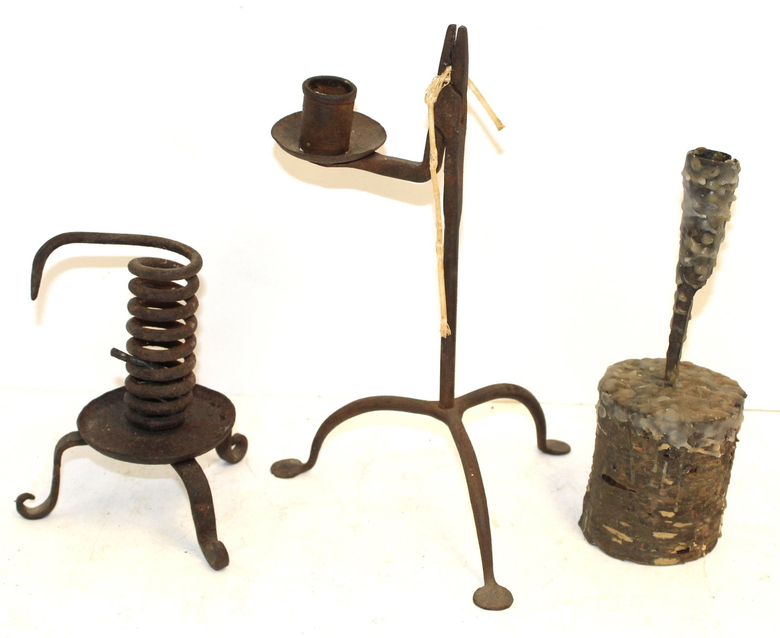 Lot of 3 iron lighting items incl rush light candle holder 10" tall; 8" make-do iron & wooden based: Lot of 3 iron lighting items incl rush light candle holder 10" tall; 8" make-do iron & wooden based candle holder & 6" spiral candle holder "rat de cave" on tripod base