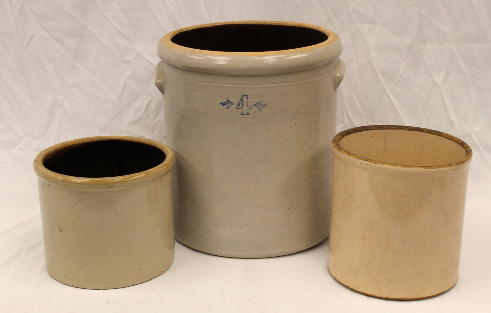 Lot of 3 stoneware crocks incl a marked 4 gal - 7 1/2" x 7 3/4" diam, 8 3/4" x 7 3/4" diam & 12 1/2": Lot of 3 stoneware crocks incl a marked 4 gal - 7 1/2" x 7 3/4" diam, 8 3/4" x 7 3/4" diam & 12 1/2" x 12" diam