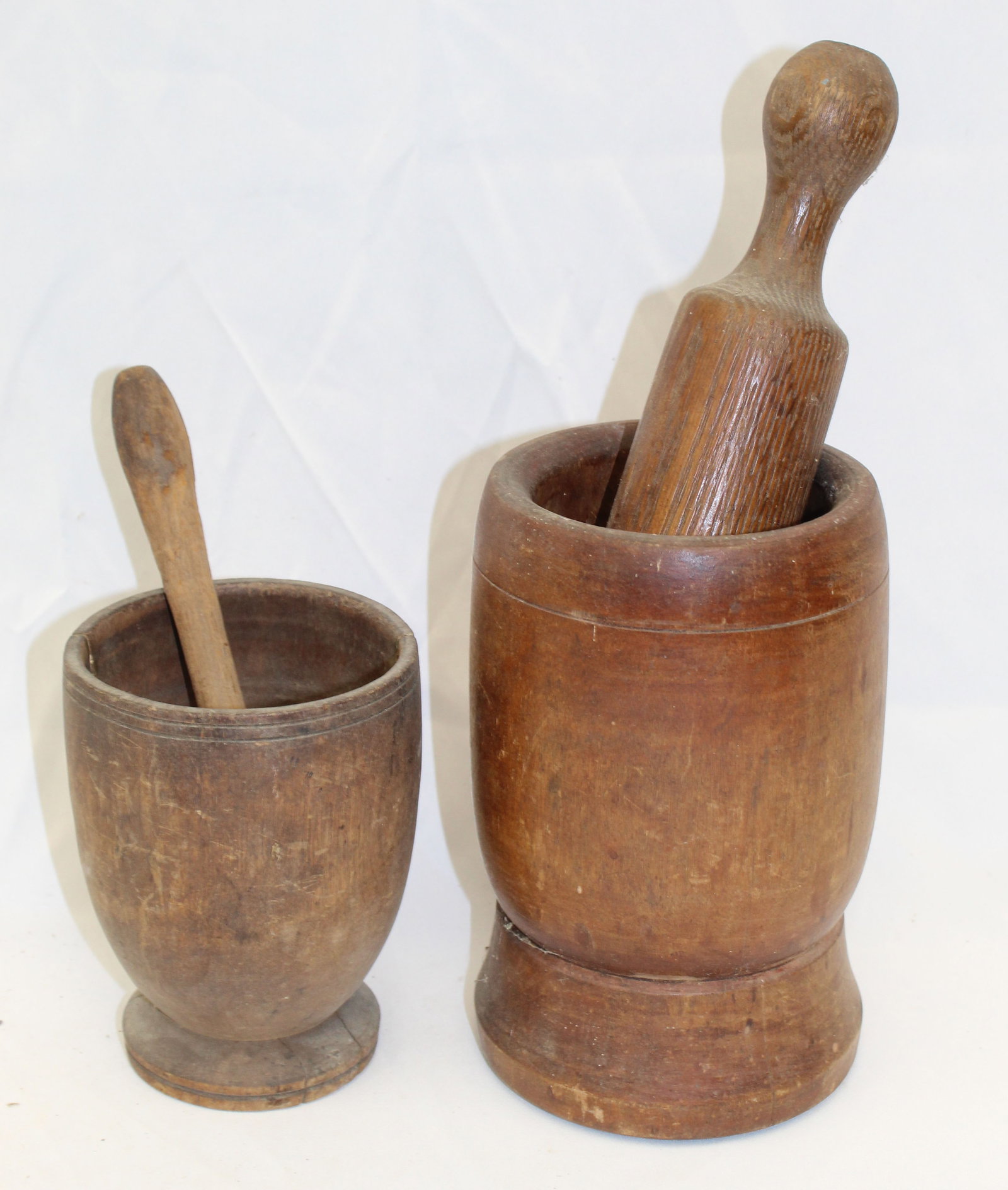 Lot of 2 antique wooden mortars & pestles - 5 1/2" & 8" tall: Lot of 2 antique wooden mortars & pestles - 5 1/2" & 8" tall