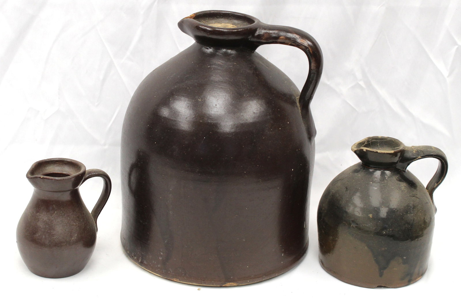 Lot of 3 stoneware pitchers incl 2 gal F. Woodworth Burlington, VT - 5", 6 1/2" & 11 1/2" tall: Lot of 3 stoneware pitchers incl 2 gal F. Woodworth Burlington, VT - 5", 6 1/2" & 11 1/2" tall