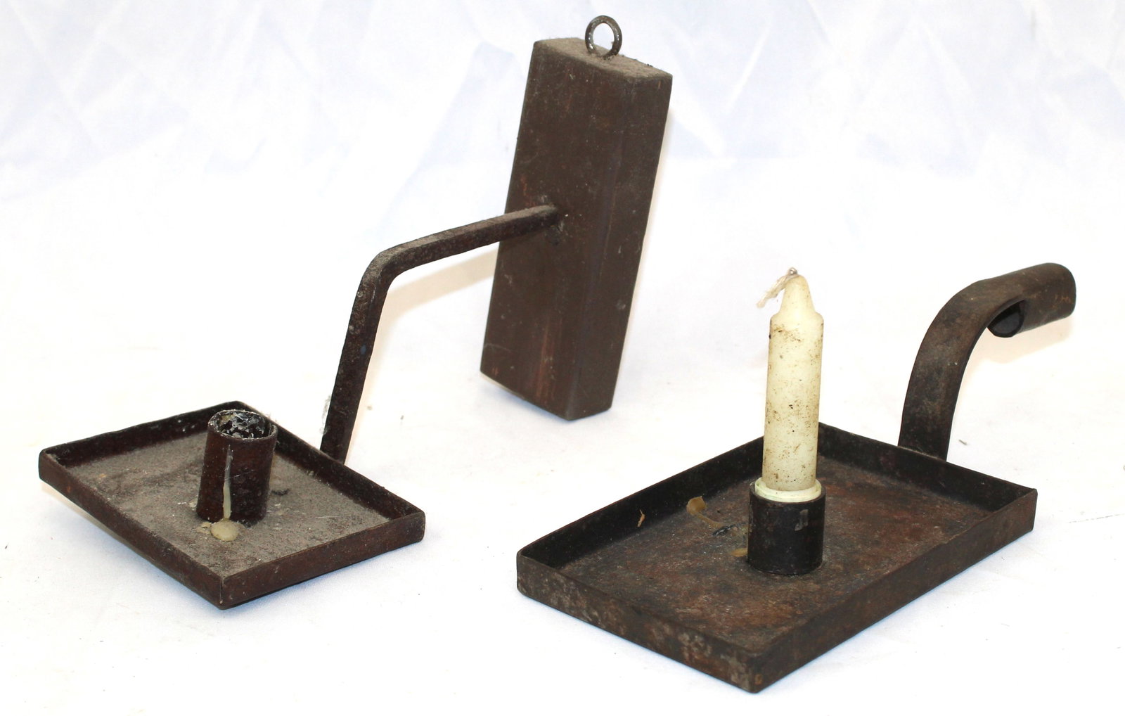Lot of 2 antique tin/iron candle holders incl sticking tommy attached to a wooden mount - approx 9": Lot of 2 antique tin/iron candle holders incl sticking tommy attached to a wooden mount - approx 9" long x 5 1/2" wide & 9 1/2" long x 4" wide
