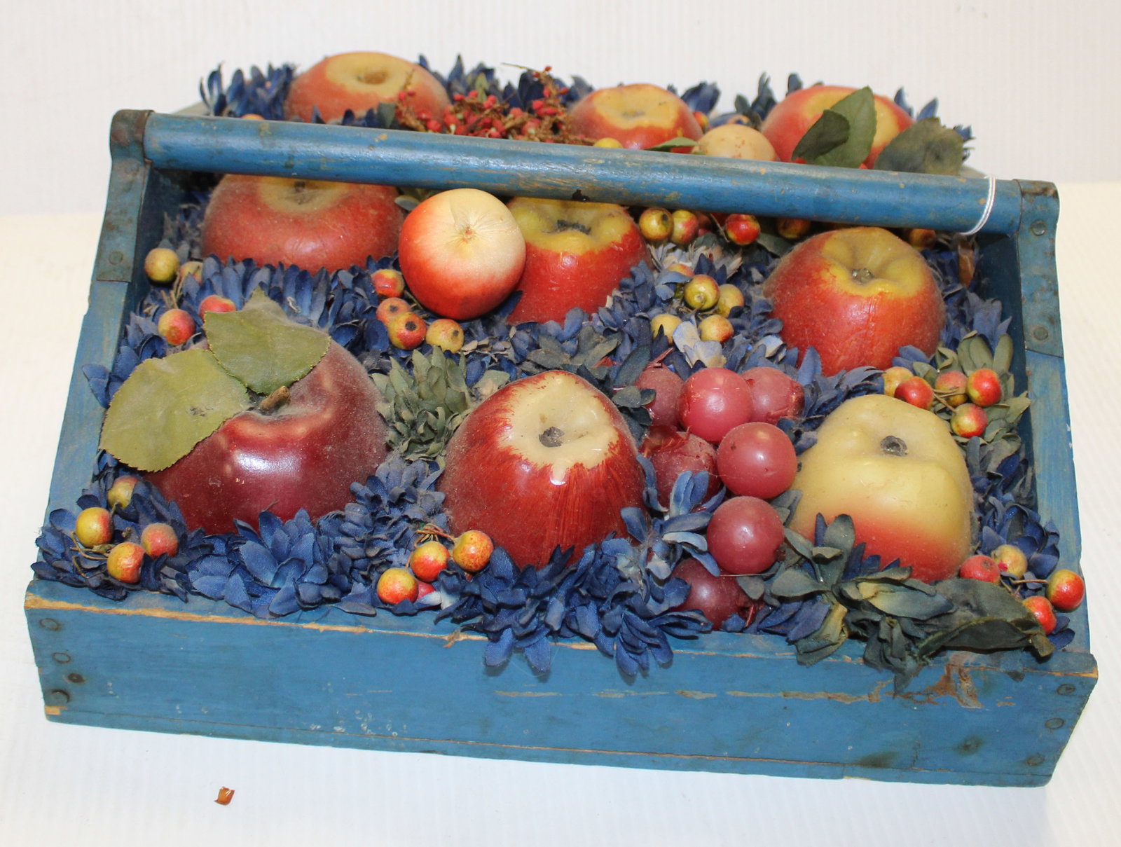 Doris Stauble folk art arrangement w fruit & flowers in blue painted utility carrier - 6" tall x 12: Doris Stauble folk art arrangement w fruit & flowers in blue painted utility carrier - 6" tall x 12 1/2" wide x 11 3/4" deep