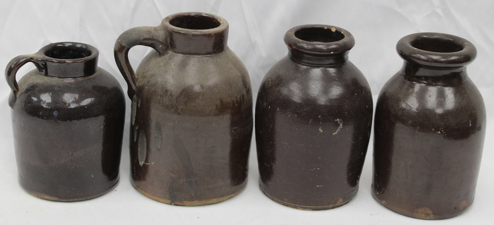 Lot of 4 stoneware items incl 3 jars & a jug - 6"-8" tall: Lot of 4 stoneware items incl 3 jars & a jug - 6"-8" tall