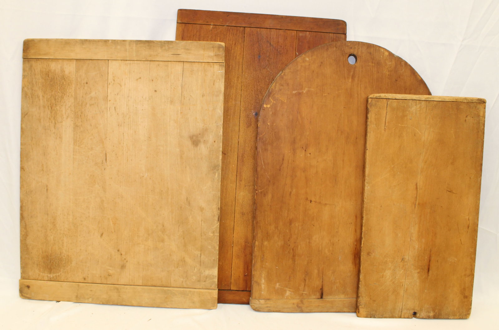Lot of 4 wooden cutting boards incl a tombstone top example - 22"x12" smallest 29"16 3/4" largest: Lot of 4 wooden cutting boards incl a tombstone top example - 22"x12" smallest 29"16 3/4" largest