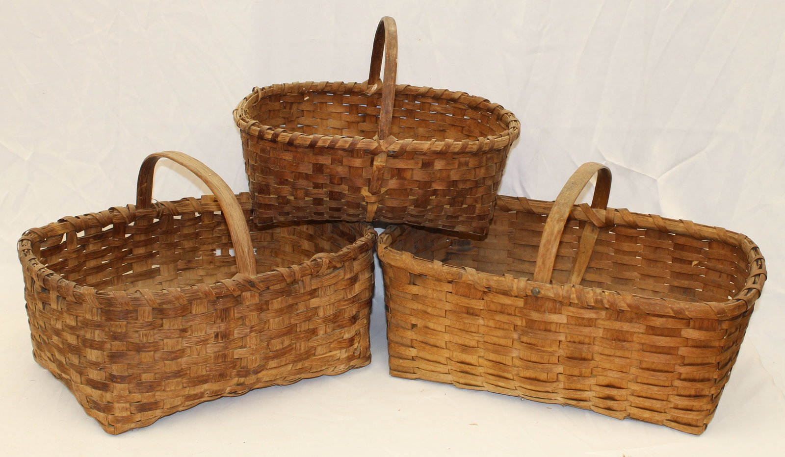 Lot of 3 antique fixed handled baskets - 12"x20"x13", 11"x18"x12" & 11"x15 1/2"x11": Lot of 3 antique fixed handled baskets - 12"x20"x13", 11"x18"x12" & 11"x15 1/2"x11"