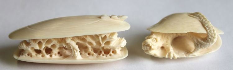 2 Chinese carved ivory clam shell items - 1 w carv: 2 Chinese carved ivory clam shell items - 1 w carved dragon (1 1/2") & a scenic dec - 2 1/2"
