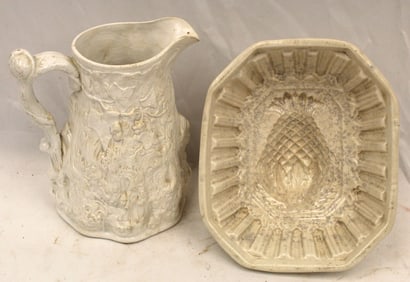 Antique salt glaze pitcher w figural relief dec together w an ironstone pudding mold