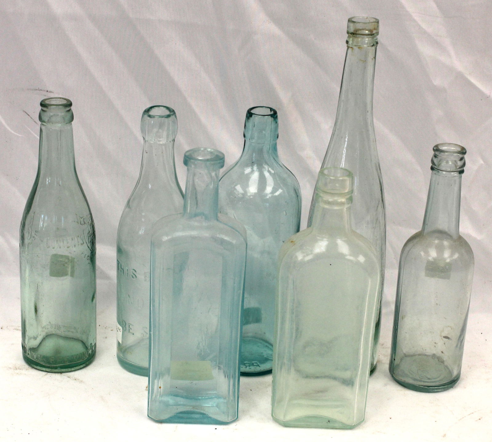 Lot of 7 aqua glass bottles in various shapes - 9" - 12" tall (1 of 5)