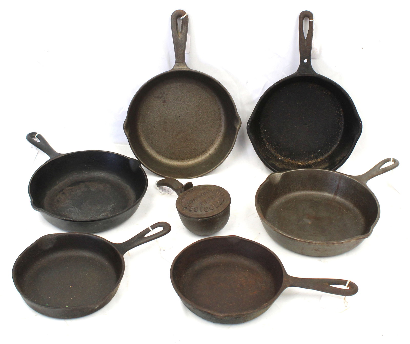 Lot of 7 small cast iron skillets: Lot of 7 small cast iron skillets