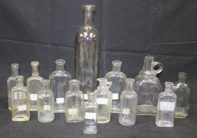 Lot of 14 clear glass medicine bottles