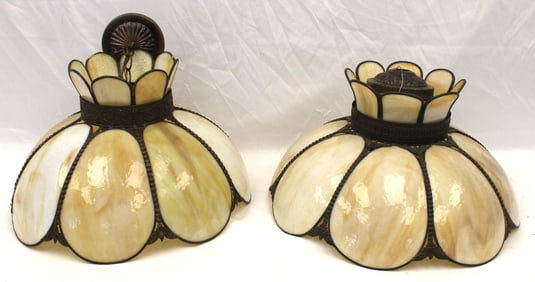 Near pair of hanging curved caramel slag glass lighting fixtures - 19" diam