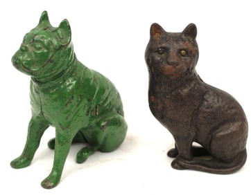 Lot of 2 cast iron still banks - dog in green paint & seated cat - 4 1/4" & 4" tall