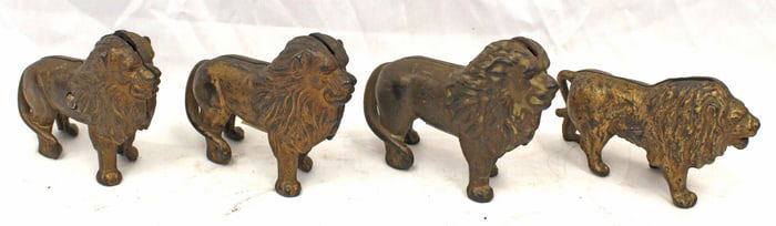 Lot of 4 cast iron lion still banks - 3 1/2" -4" tall
