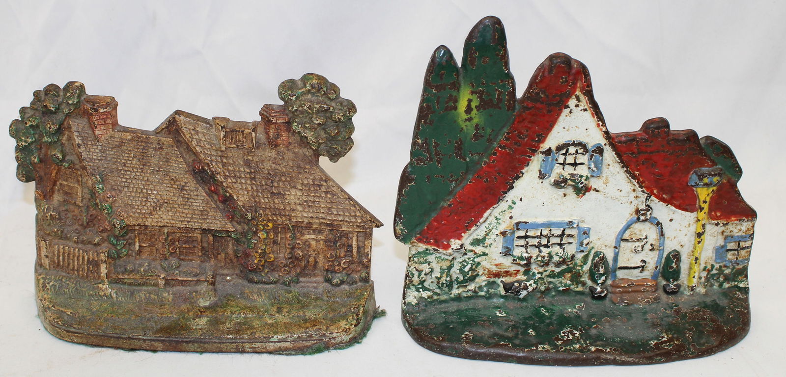 Lot of 2 cast iron painted house doorstops - 7"x9" & 6"x8": Lot of 2 cast iron painted house doorstops - 7"x9" & 6"x8"