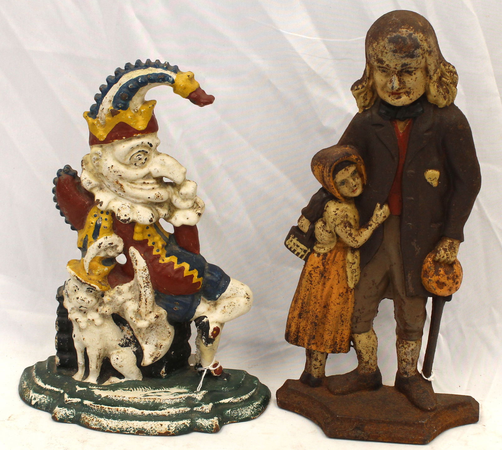 Lot of 2 cast iron doorstops - Punch & Silas Marner w Eppie - 12" & 15": Lot of 2 cast iron doorstops - Punch & Silas Marner w Eppie - 12" & 15"