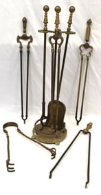 Brass fireplace tools in holder